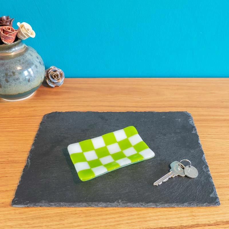 Green and white checkered fused glass dish on slate, handmade British craft