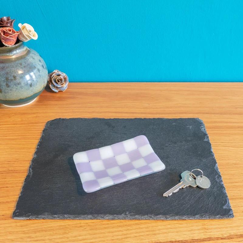 Purple and white checkered glass trinket dish on slate, keys beside, handmade British craft