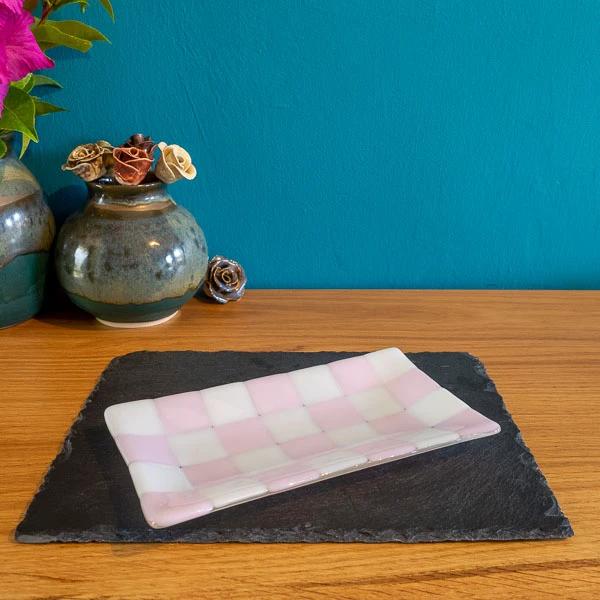 Handmade pink and white checkered glass tray on slate, British craft decor