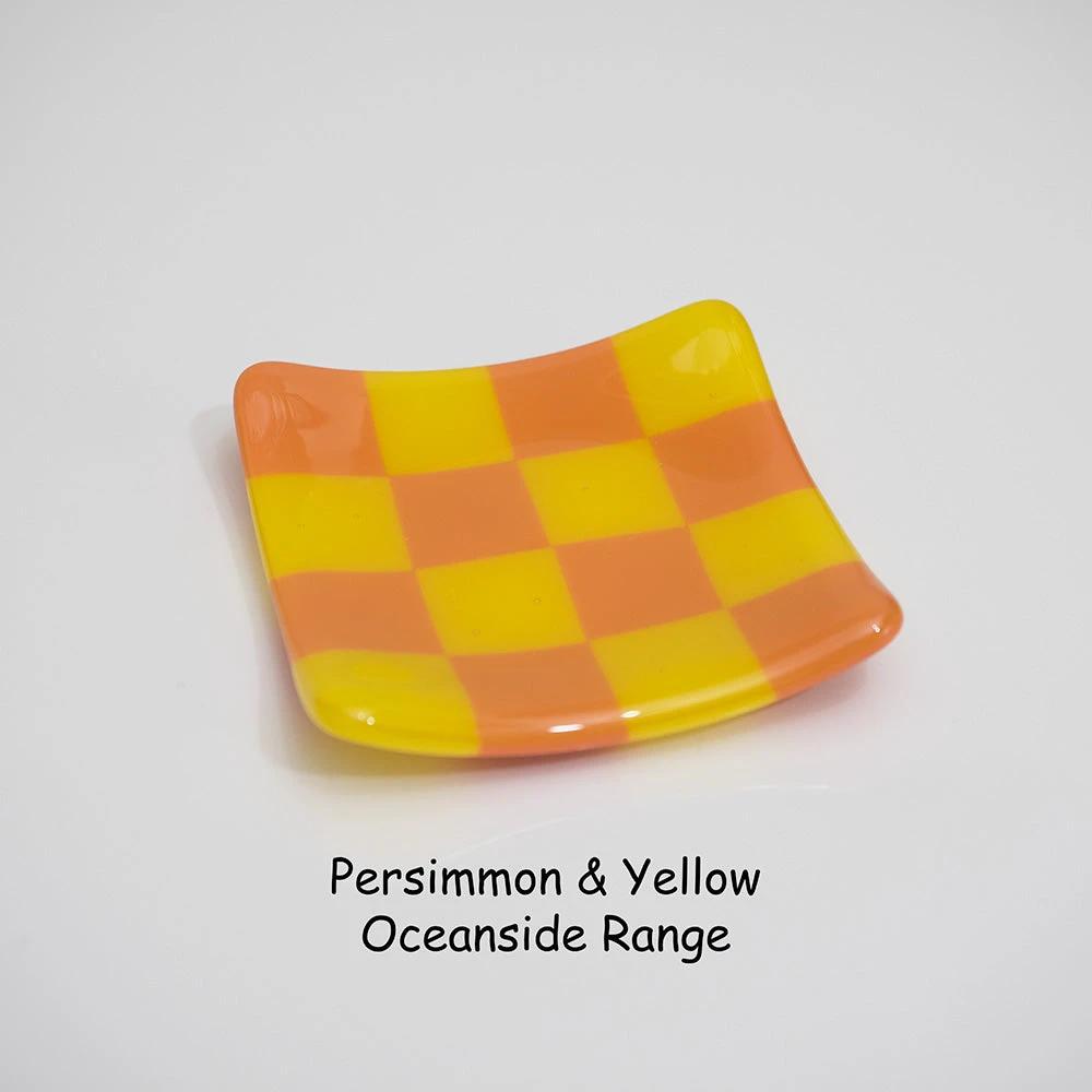 Persimmon and yellow checkered glass dish from Oceanside Range, handmade British craft