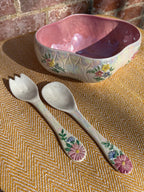 Floral salad bowl, with serving utensils