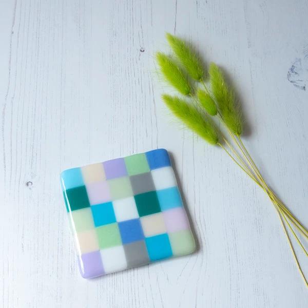 Handmade fused glass coaster with pastel checkered pattern, British craft, artisanal home decor
