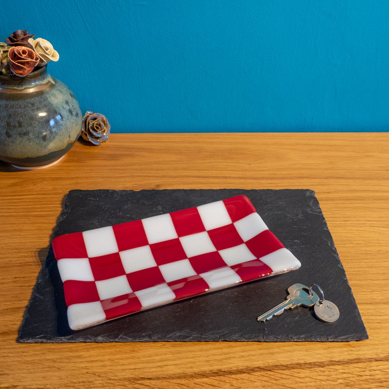 Red and white checkered glass tray on slate, keys beside, handmade British craft