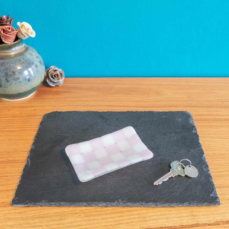 Pink and white checkered glass trinket dish on slate, keys beside, handmade British craft